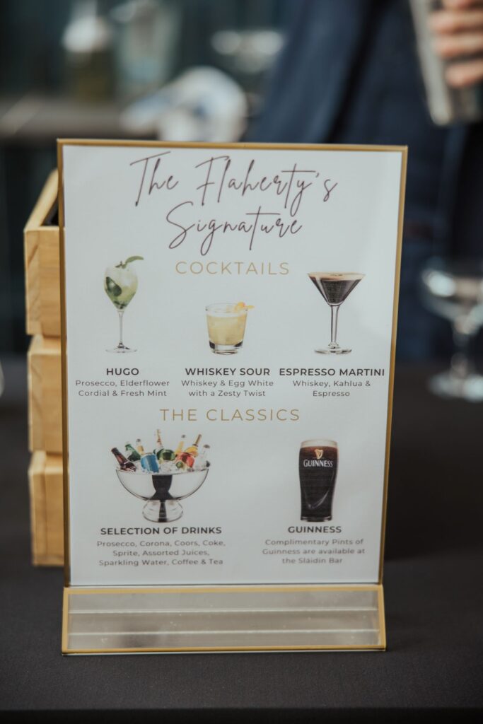 A drinks menu sign displays 